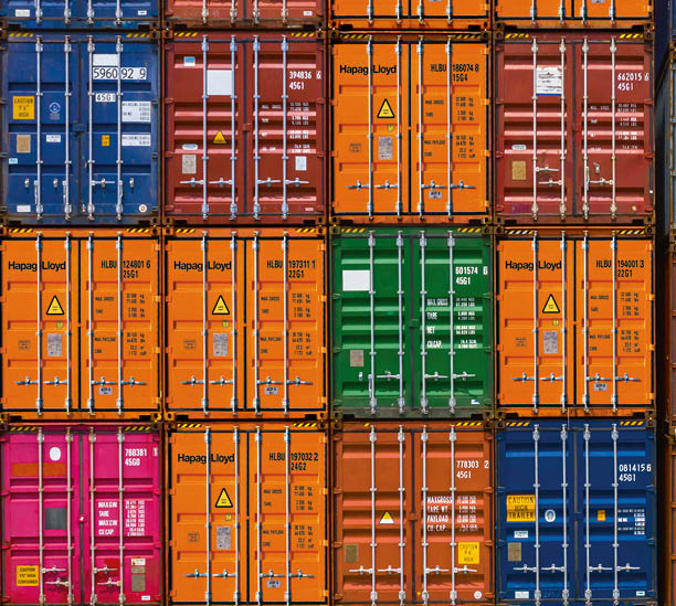 Container ship loading and unloading in deep sea port, Aerial top view of business logistic import and export freight  transportation by container ship in open sea.