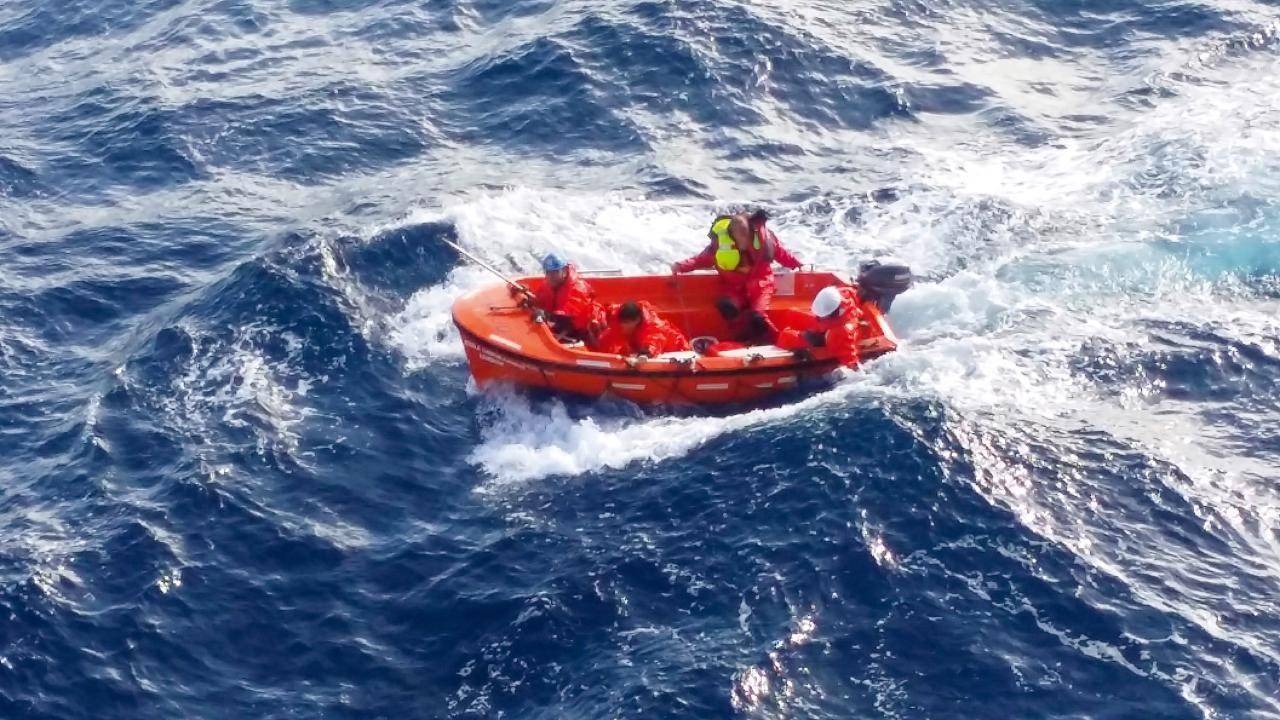 Successful rescue: With the yachtsman safely on board, the lifeboat returns to the container ship.