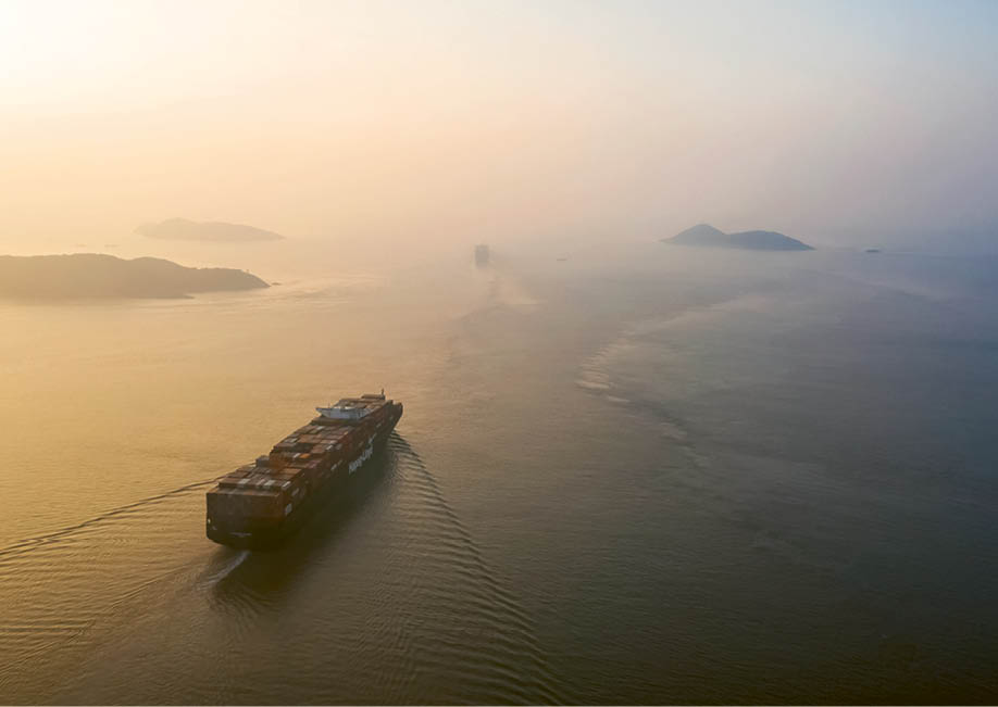The Hapag-Lloyd AG Leverkusen Express sails out of the Yangshan Deepwater Port, operated by Shanghai International Port Group Co  (SIPG), in this aerial photograph taken in Shanghai, China, on Wednesday, Aug  7, 2019  Trump's threat to raise tariffs on all Chinese goods last week shattered a truce reached with Xi just weeks earlier, unleashing tit-for-tat actions on trade and currency policy that risk accelerating a wider geopolitical fight between the world's biggest economies  Photographer: Qilai Shen Bloomberg via Getty Images