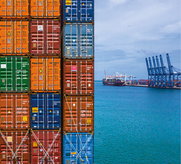 Container ship loading and unloading in deep sea port, Aerial top view of business logistic import and  export freight  transportation by container ship in open sea 