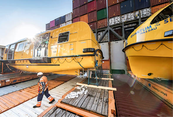 Hapag- Lloyd Special Cargo Unit  Lifeboats for the Quantum of the Seas being loaded onto the NYK Orion at Container Terminal Altenwerder in Hamburg, Germany 